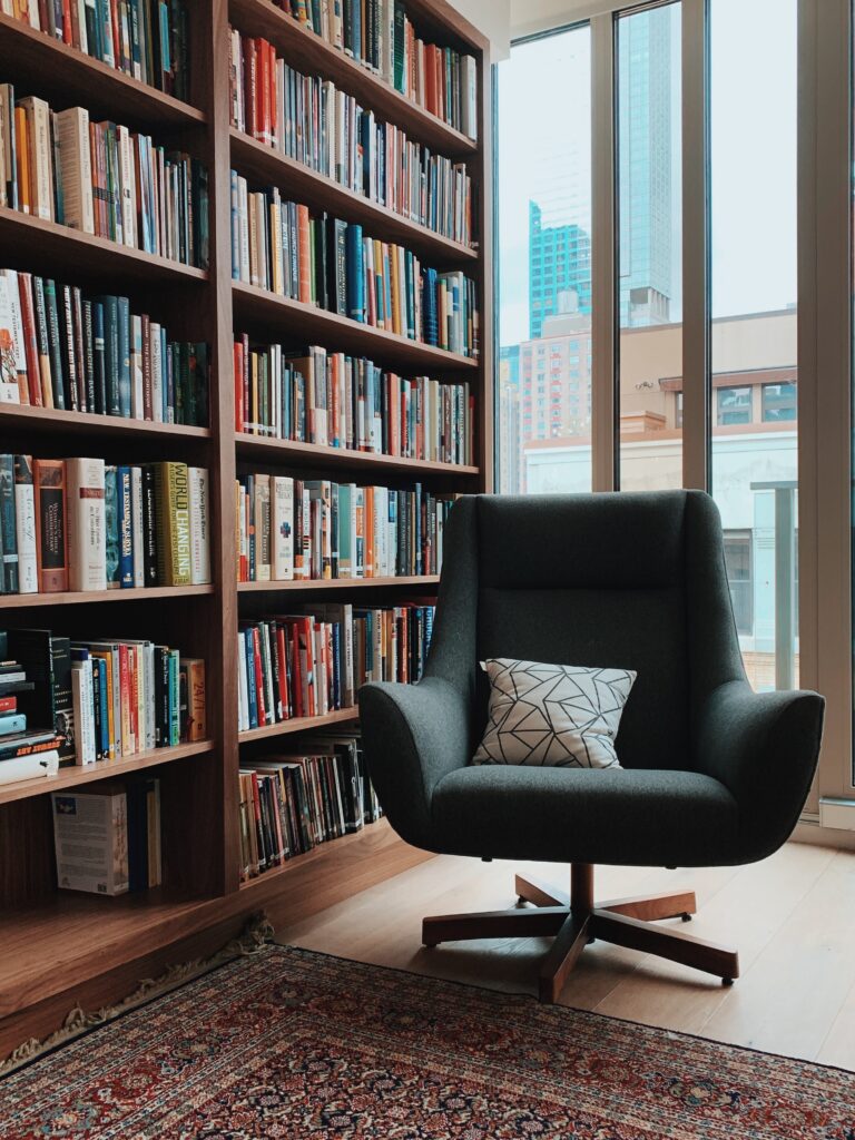 Unlock the Secret: How to Read Free English Books a chair behind a floor rug in front of a bookcase. Get the best reading apps and read free books online